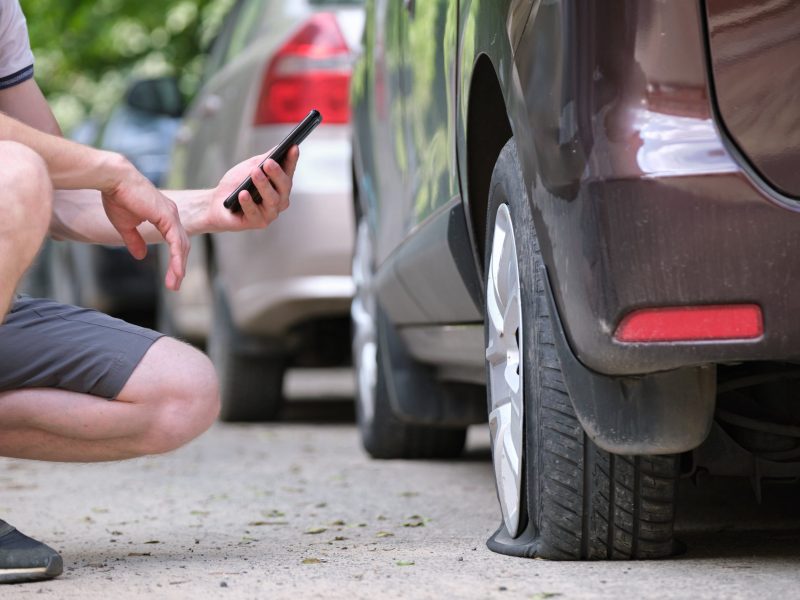 driver-calling-road-service-for-assistance-having-2022-07-15-18-27-15-utc-min